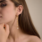 Rectangular-link tassel earring shown on a model