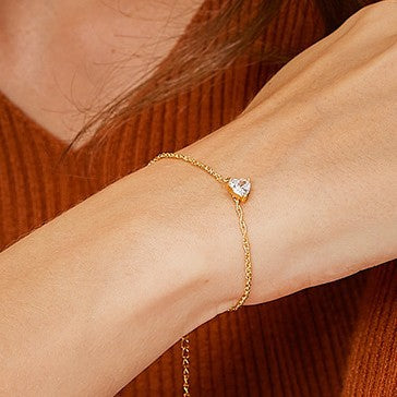 side wrist view of gold plated clear heart pendant bracelet