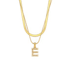 Imitation pearl letter E pendant on layered stainless steel chains