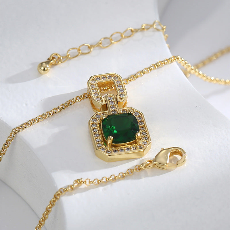 Green stone pendant necklace showing its lobster clasp and extension chain