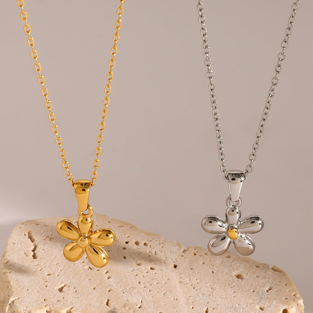 Five-petal stainless steel flower necklaces on display