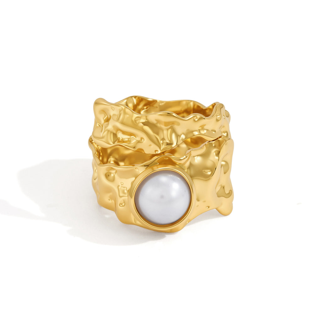 Front view of wide sculptural pearl-look ring