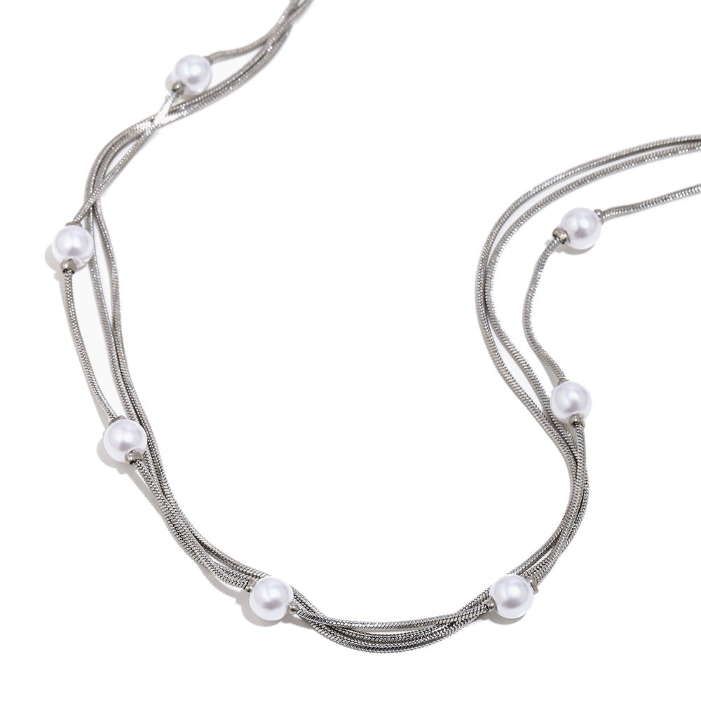 Steel color snake-chain necklace with faux pearl accents