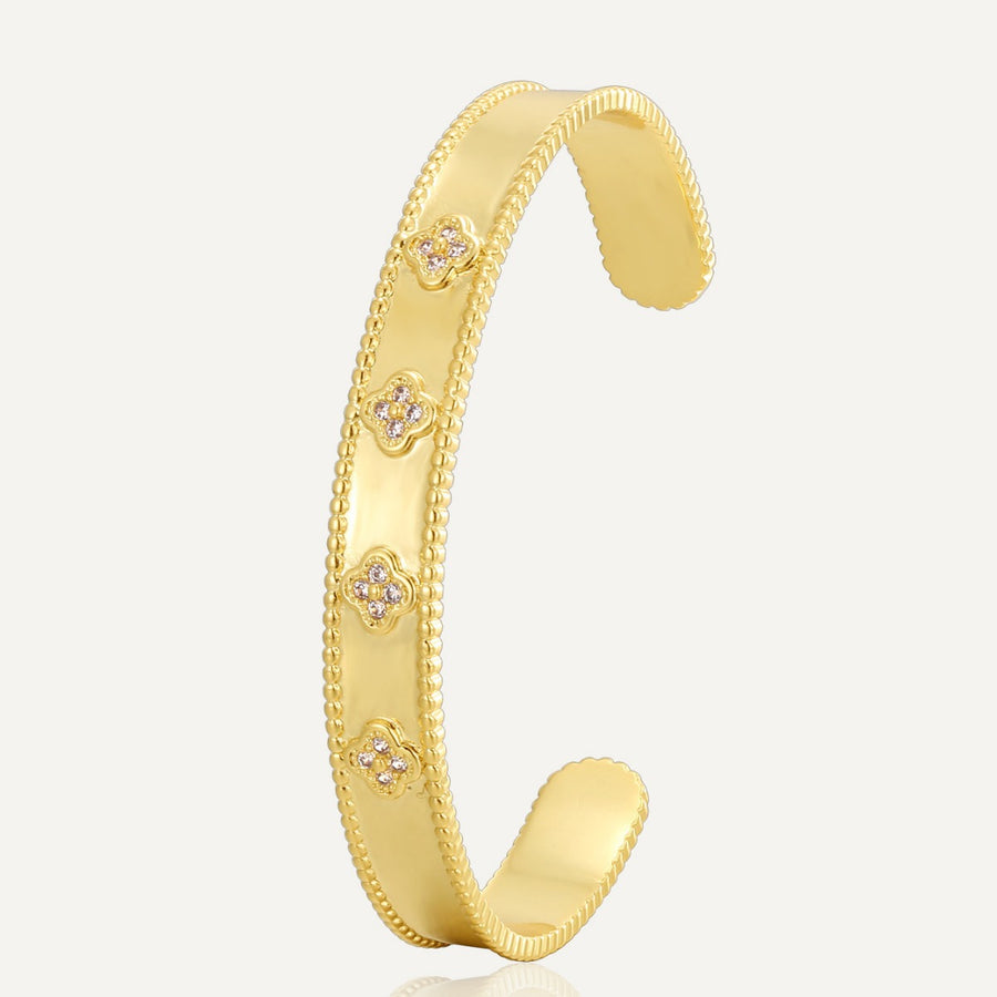 gold plated clover clear stone open bangle on white