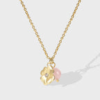 gold plated floral pendant necklace with pink quartz bead and clear center accent