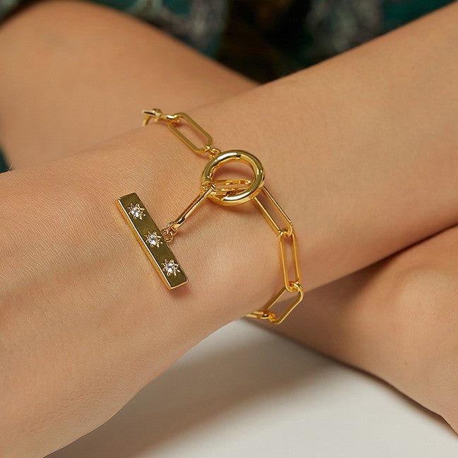 close wrist view of round toggle and star-accent bar