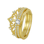 isolated gold plated crown scroll ring with clear accent stones