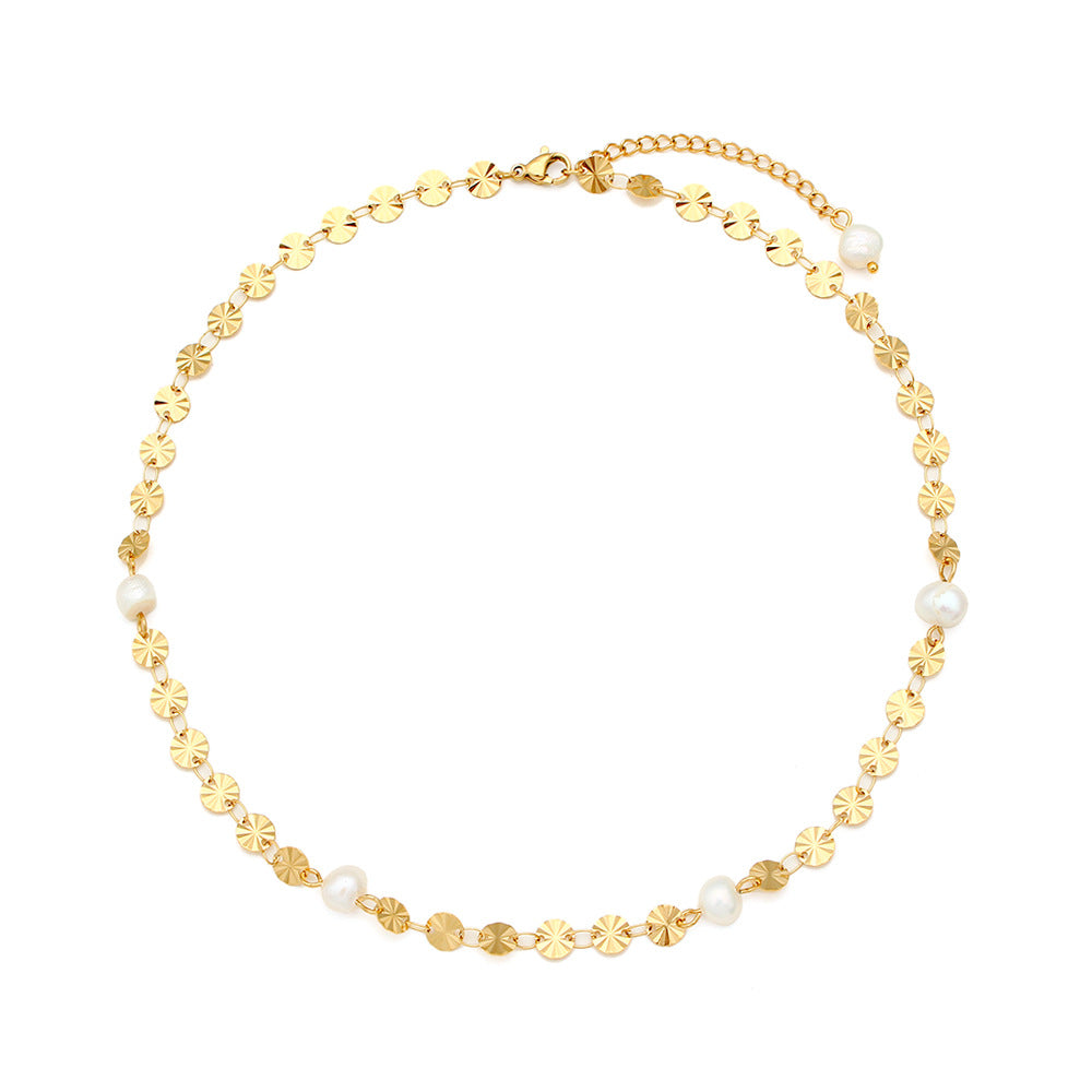Full necklace showing sunburst discs freshwater pearls and clasp
