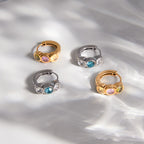 Colored stone hoops with hinges visible