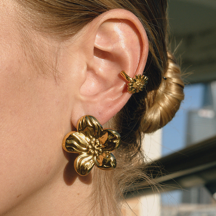 Gold-Tone Floral Stainless Steel Earring Collection shown on model