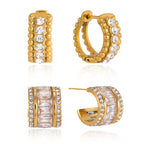 Wide and compact clear stone earrings on white