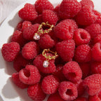 Zirconia drop hoops arranged on raspberries