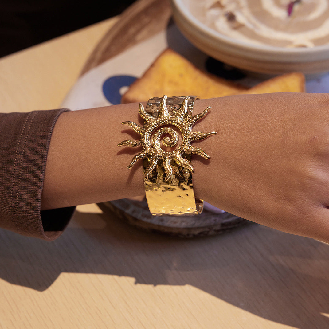 hammered stainless steel sun cuff styled with a brown sleeve