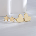 gold plated heart and star stud earrings shown as a two-pair set