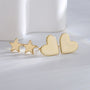 gold plated heart and star stud earrings shown as a two-pair set