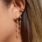 clear rhinestone asymmetric chain earrings worn with gold huggie