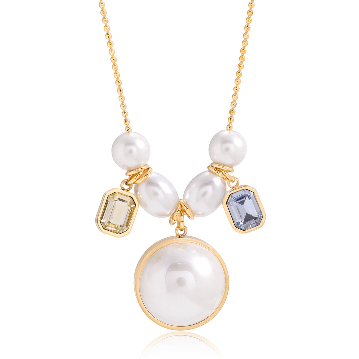 Round white pendant and two rectangular accents on a gold-tone chain