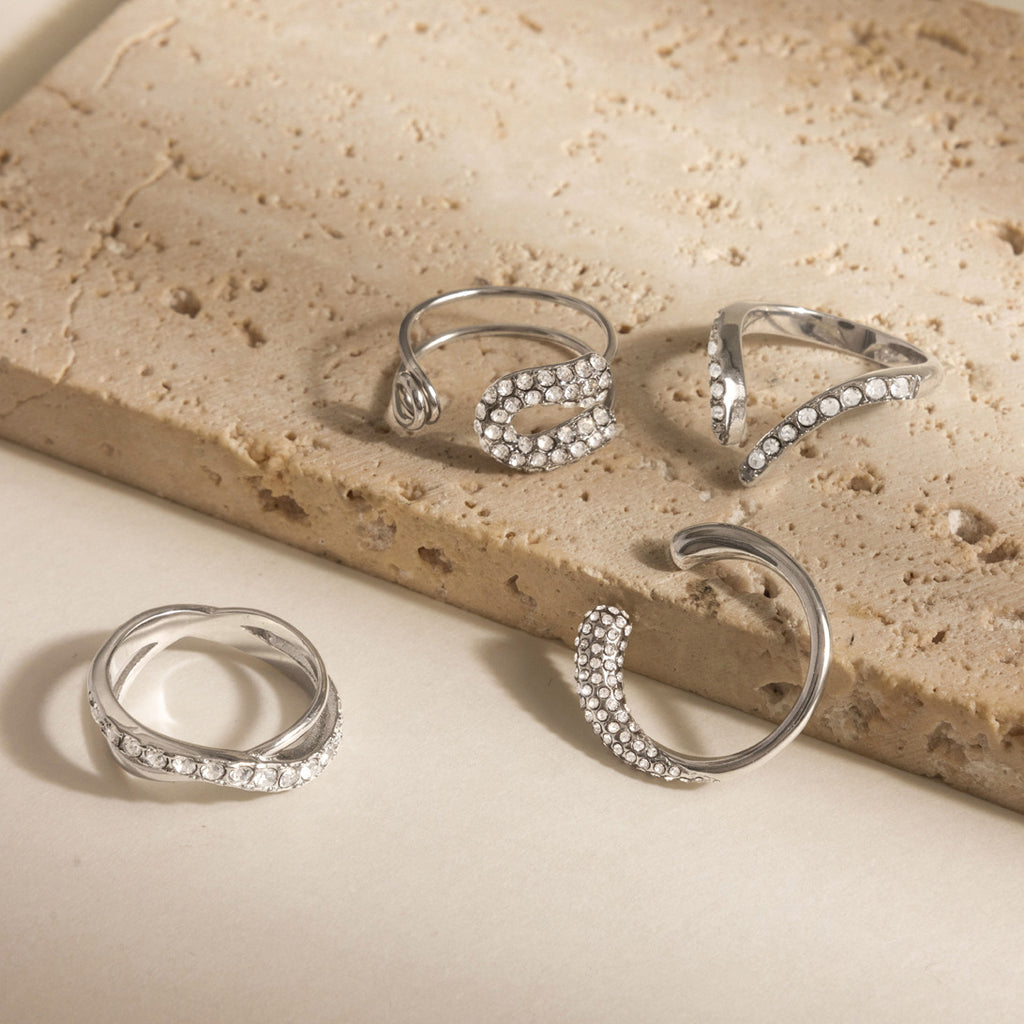 Open and crossover ring designs on stone blocks