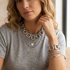Square-link jewelry styled together on a model