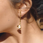 side view of sculptural calla lily pearl drop earring