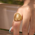 Large diamond lattice dome ring shown close-up on finger
