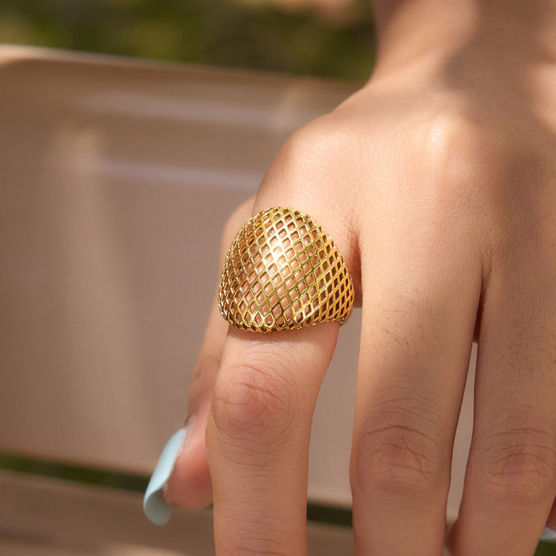 Large diamond lattice dome ring shown close-up on finger