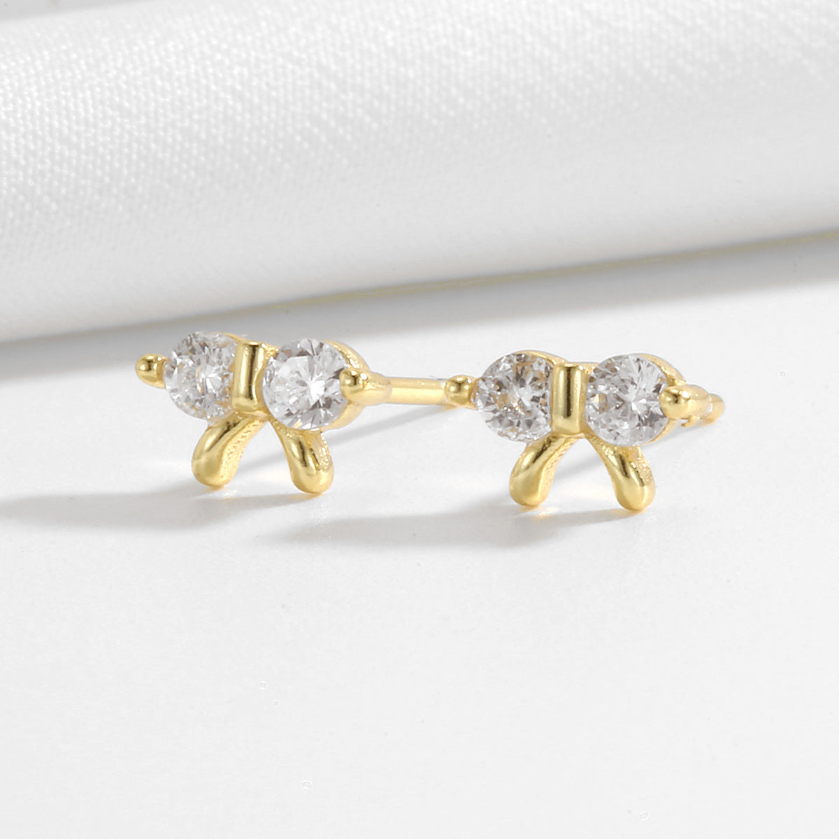 pair of petite 925 silver clear stone bow stud earrings