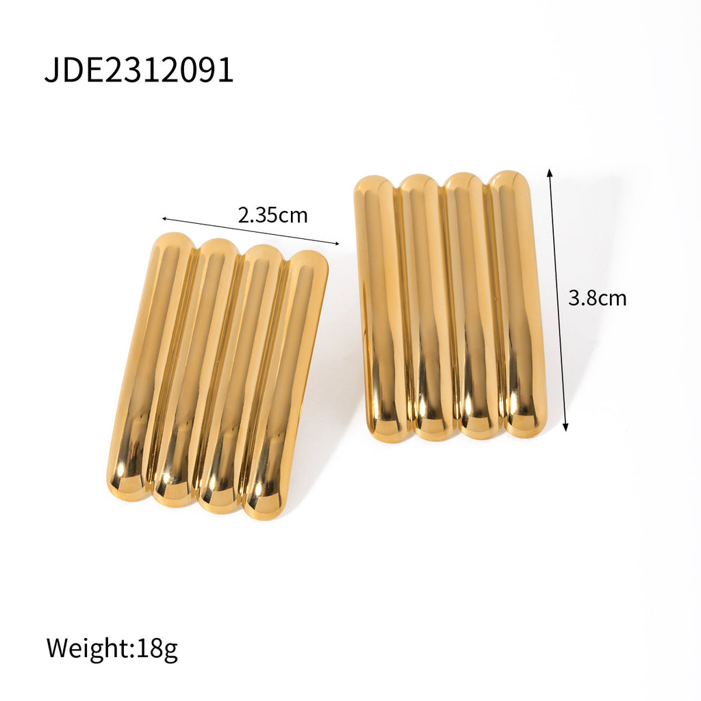 Gold-tone ribbed statement studs with width and height