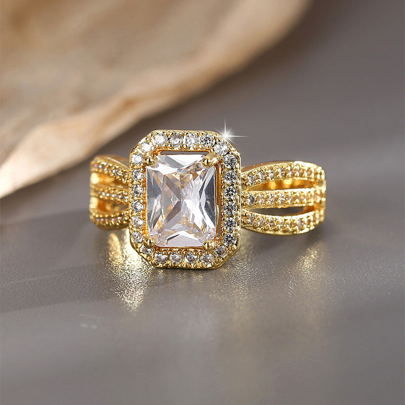 front view of the clear stone halo and pavé-style ring band