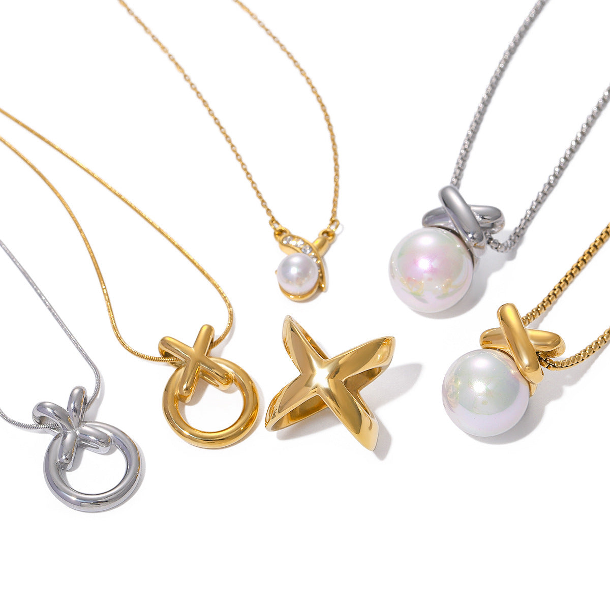 XO circle pendants and separate pearl-drop necklace references on white
