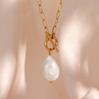 gold plated stainless steel toggle necklace with irregular freshwater pearl drop