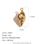 Conch-shaped charm with pearl-look accent