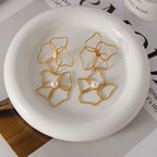 open floral statement earring pair with white pearl-style beads
