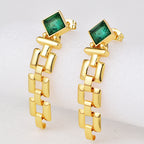 gold plated green zirconia link drop earrings in an angled studio view