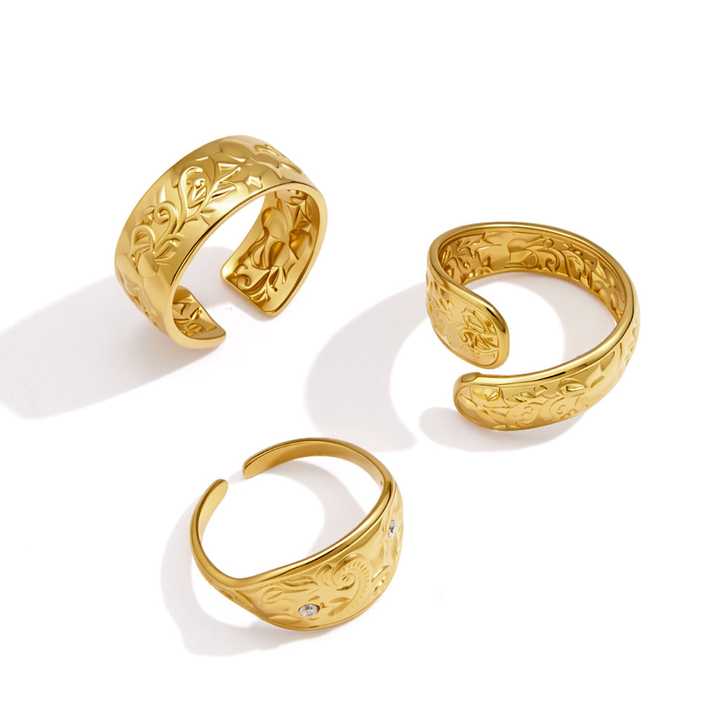 Front and interior views of patterned gold tone rings