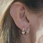 Layered ring huggie shown in a mixed earring arrangement
