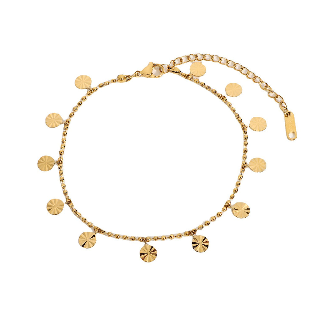 Gold-tone anklet with extension chain on white background