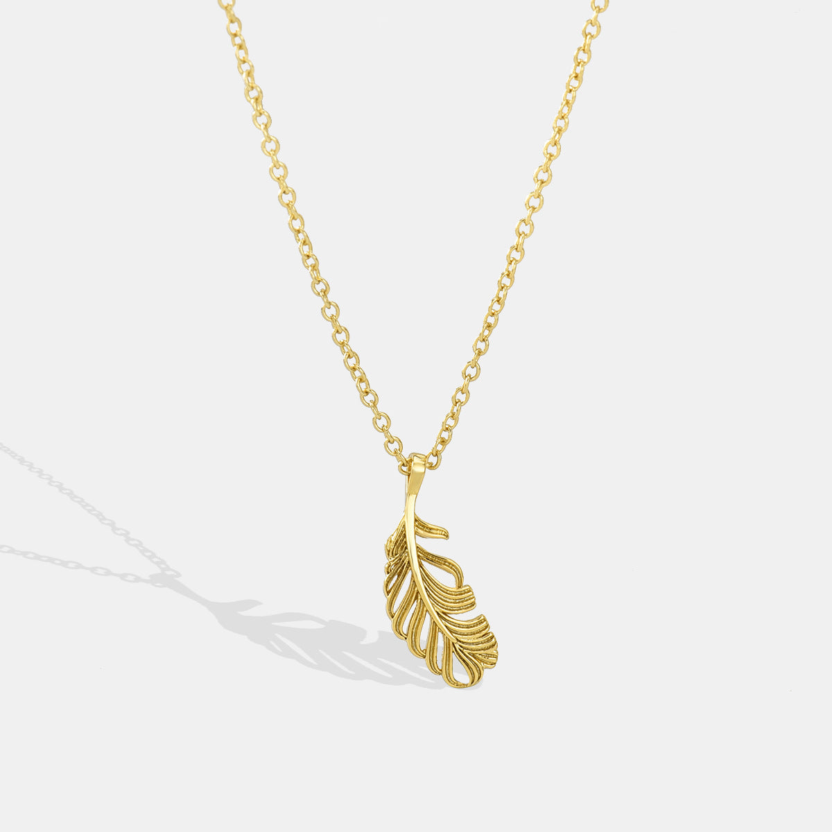 gold plated brass openwork feather pendant necklace