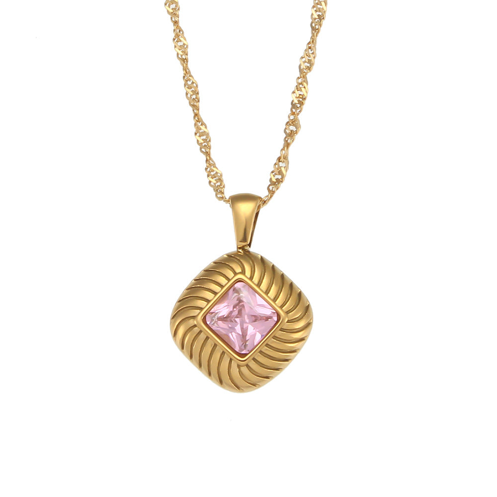 gold plated square pendant with a pink faceted center stone