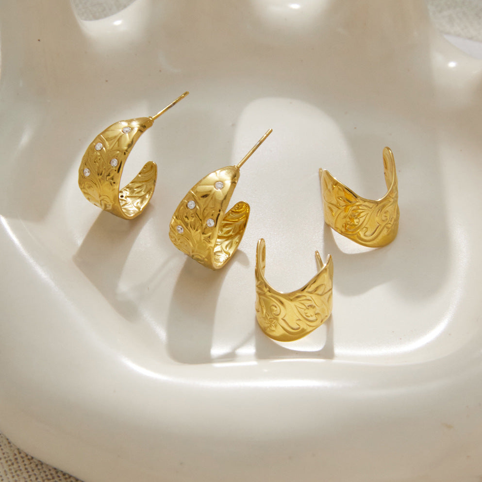 Decorative open hoops displayed on a white tray