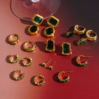 Mix of green accent hoops, studs and drop earrings