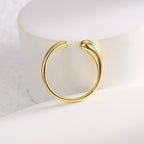 front view of smooth stone-free teardrop open ring
