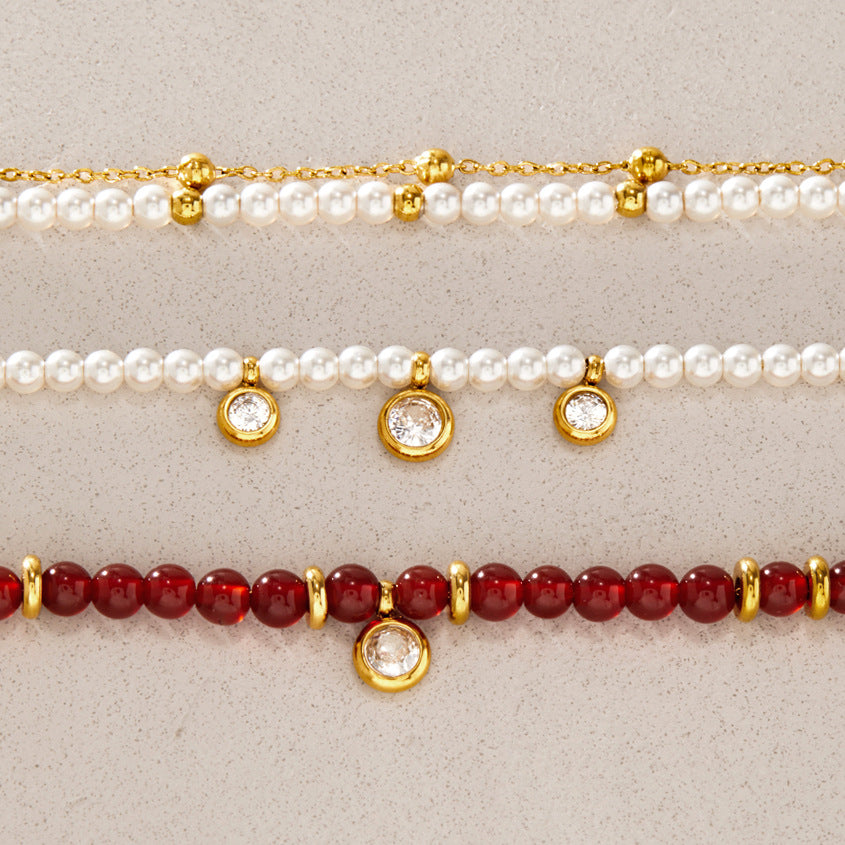 Red and white beaded bracelet details with clear round drops