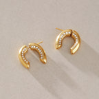 Gold-tone U earrings with inner clear accent rows