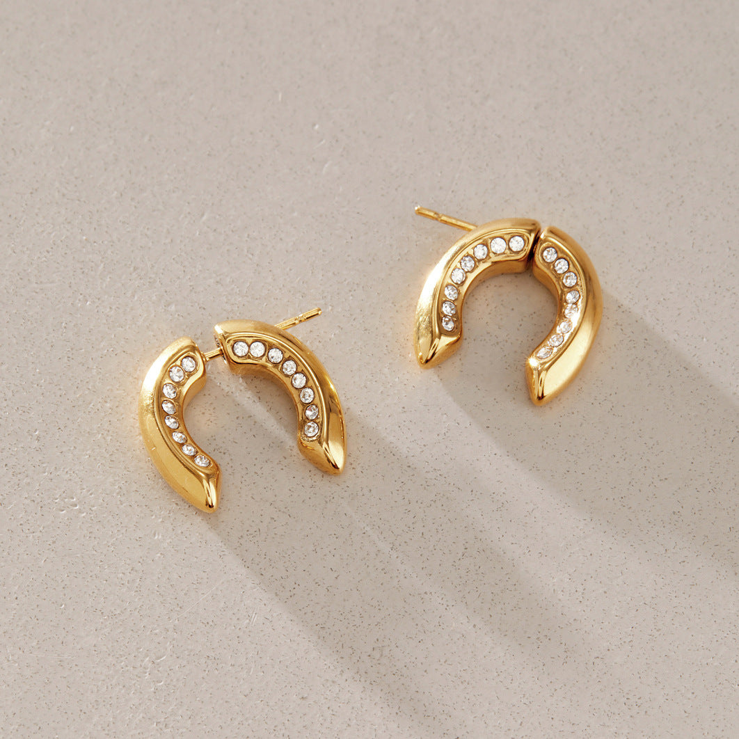 Gold-tone U earrings with inner clear accent rows