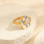 gold plated stainless steel flower ring with ivory petal inlays