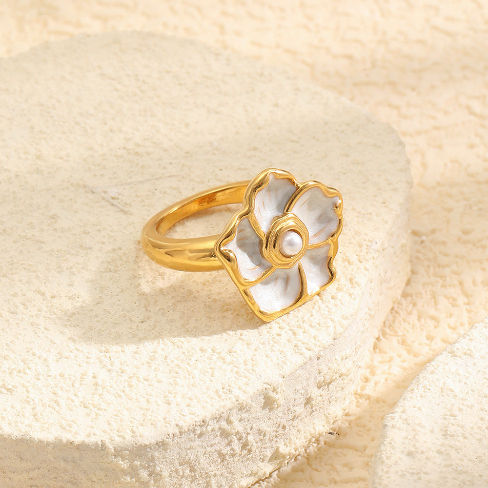 gold plated stainless steel flower ring with ivory petal inlays