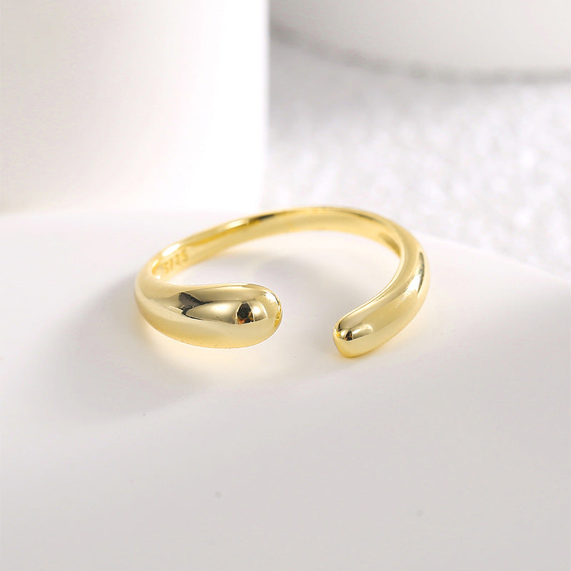 angled view of polished adjustable open ring with rounded ends