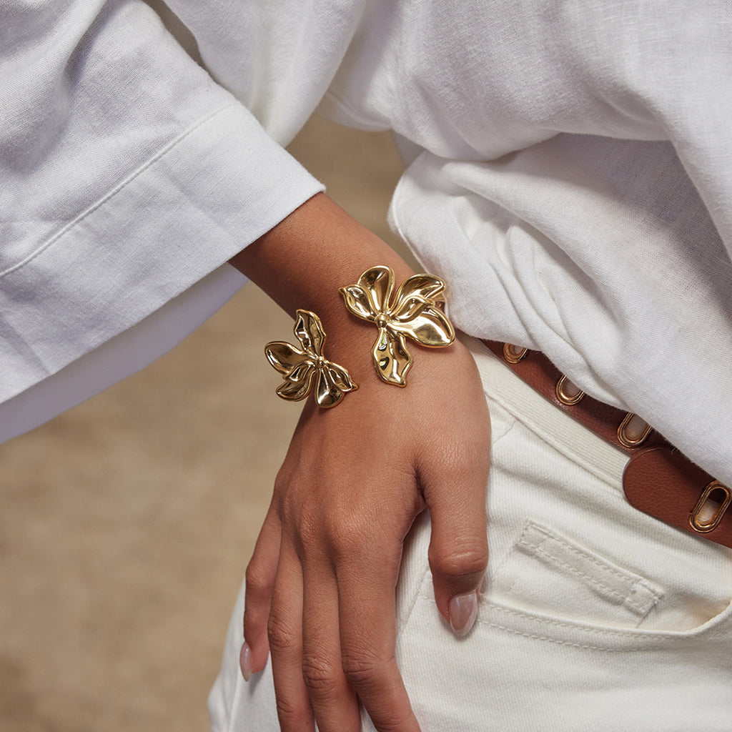 Gold-Tone Stainless Steel Sculptural Floral Jewelry Collection — front view