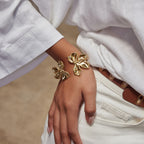 Gold-Tone Stainless Steel Sculptural Floral Jewelry Collection — front view